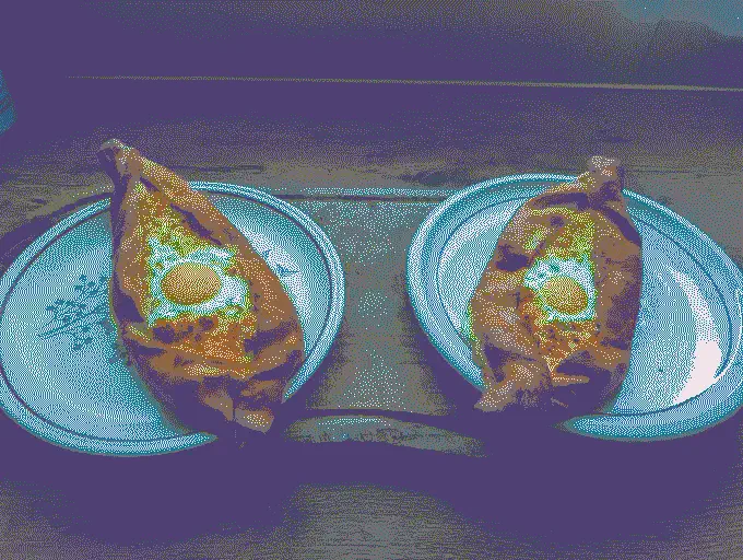 
              Two Khachapuri: 'Boat' shaped dough with cheese and egg in the middle
            