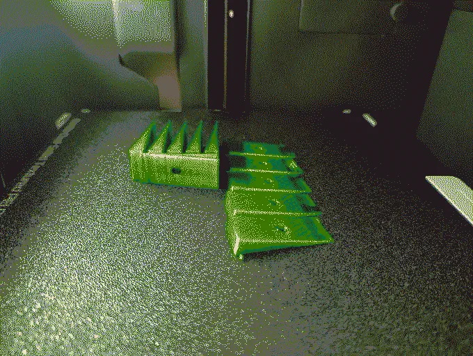 
              3D-printed triangles on a 3D-printer print bed
            