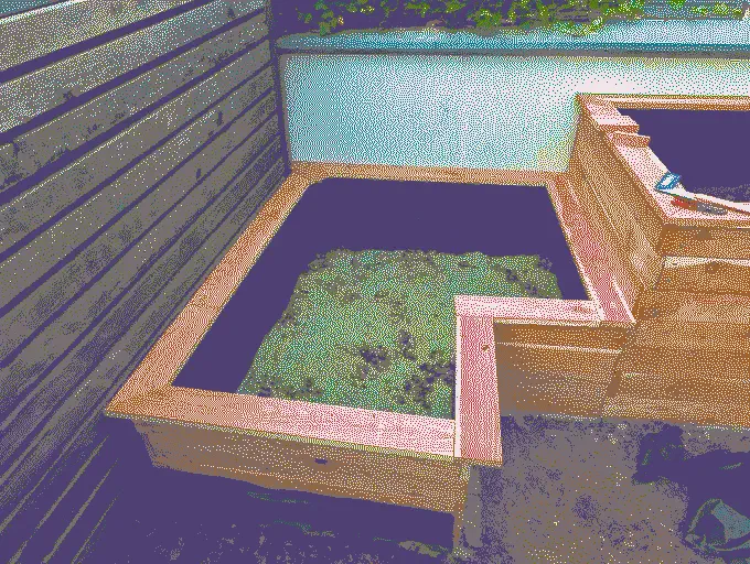 
              The small planter with the topper already attached and filled with gravel
            